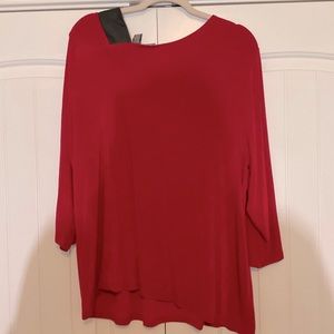 Red top with a leather Accent on the color